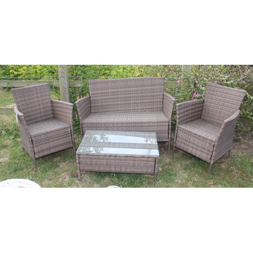 331 - A 4 piece rattan garden set, 2 chairs, a 2 seater sofa and a small low table