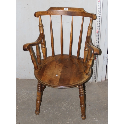 34 - A 19th century beech farmhouse kitchen stickback armchair with penny seat