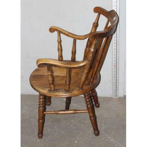 34 - A 19th century beech farmhouse kitchen stickback armchair with penny seat