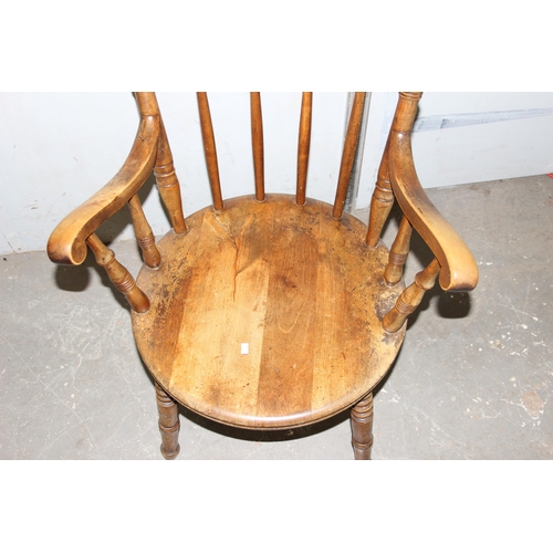 34 - A 19th century beech farmhouse kitchen stickback armchair with penny seat