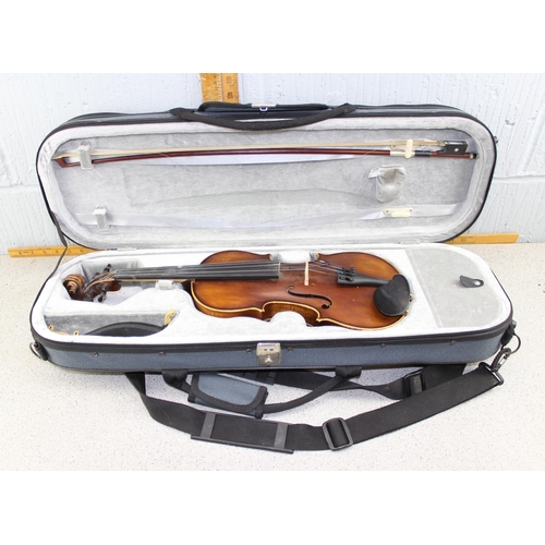 653 - Violin in modern case, one piece back, partial label for Giovanni, with bow