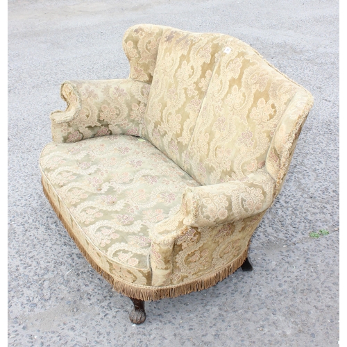 66 - An early 20th century 2 seater sofa or love seat with carved wooden legs