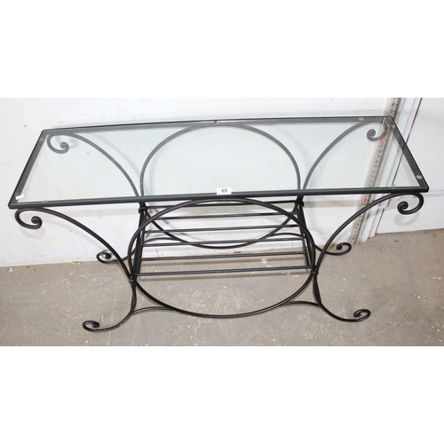 69 - A wrought iron and glass topped hall table