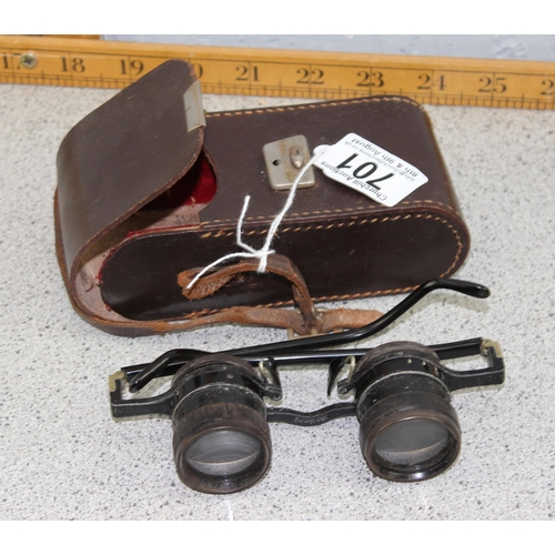 701 - A pair of early 20th century German made binocular glasses, in leather case