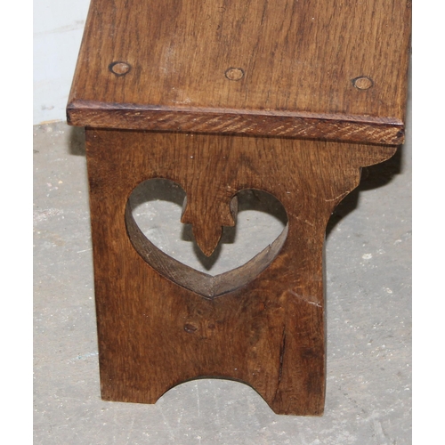 74 - A small wooden milking stool with heart pierced carving