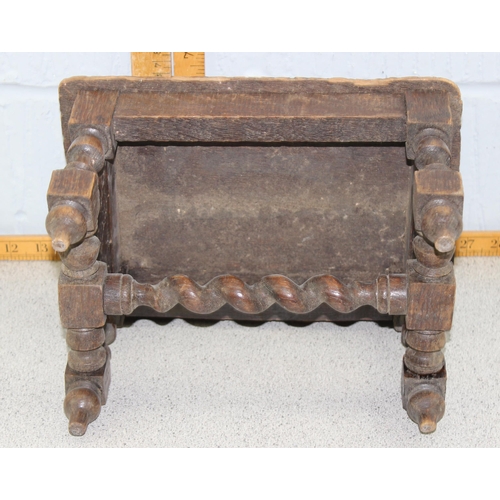 81 - A small antique carved oak stool