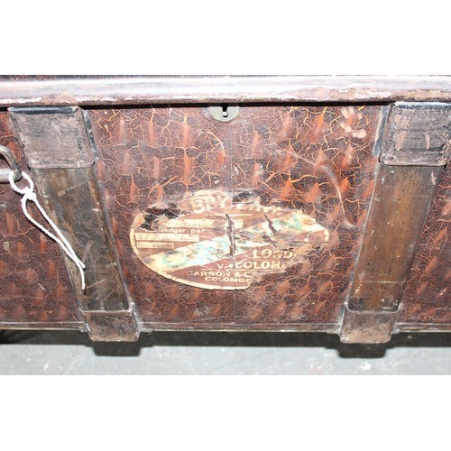 62 - An antique metal toleware shipping trunk with added metal legs for coffee table conversion