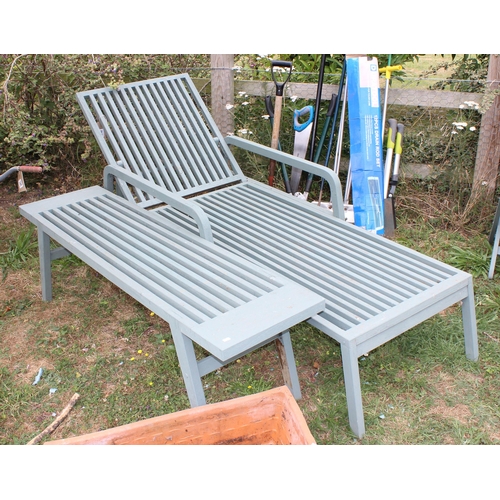 340 - A green painted wooden garden lounger and a long slatted table (2)