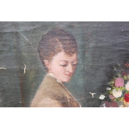 406 - An antique oil on canvas of a lady arranging flowers, unsigned, late 19th or early 20th century, rem... 