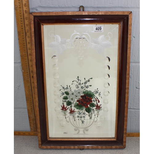 409 - A vintage wooden framed mirror with painted and engraved floral decoration