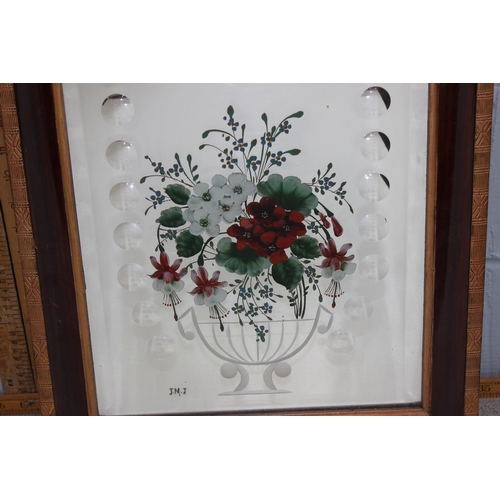 409 - A vintage wooden framed mirror with painted and engraved floral decoration