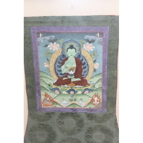 418 - A vintage Buddhistic painting on fabric panel