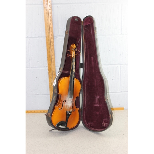 654 - Violin in case