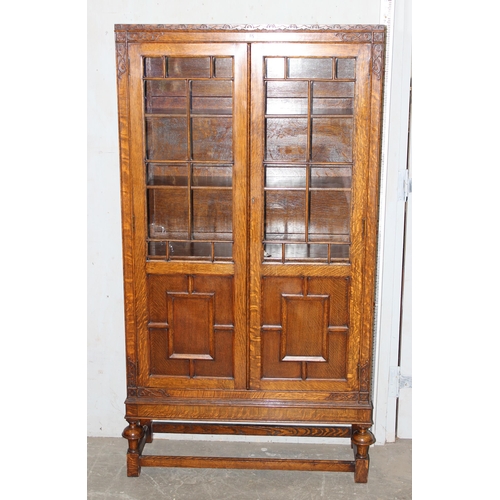 85 - An early 20th century glazed oak bookcase