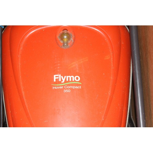 335 - Flymo electric lawn mower in box