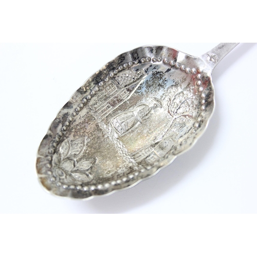 1101 - A white metal spoon with embossed decoration, likely Dutch with indistinct mark