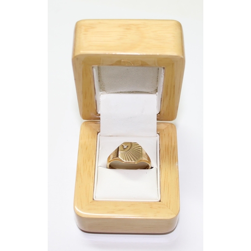 1219 - 9ct gold signet ring with engraved design and small diamond, approx size T & 4.7g gross