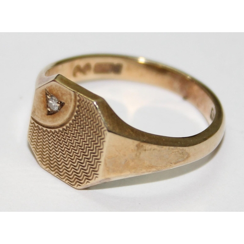 1219 - 9ct gold signet ring with engraved design and small diamond, approx size T & 4.7g gross