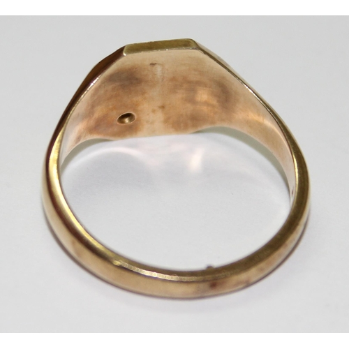 1219 - 9ct gold signet ring with engraved design and small diamond, approx size T & 4.7g gross