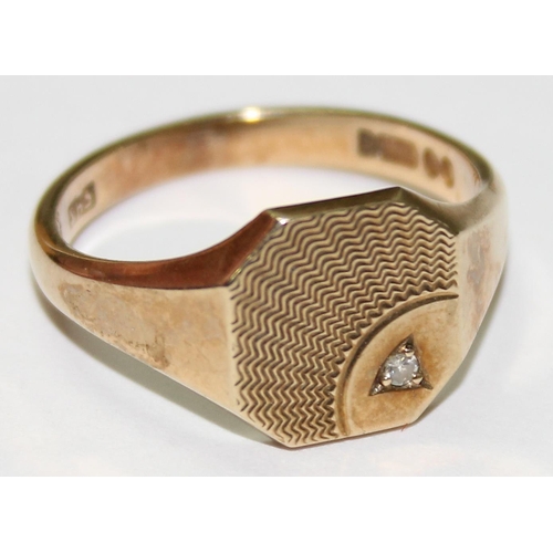 1219 - 9ct gold signet ring with engraved design and small diamond, approx size T & 4.7g gross