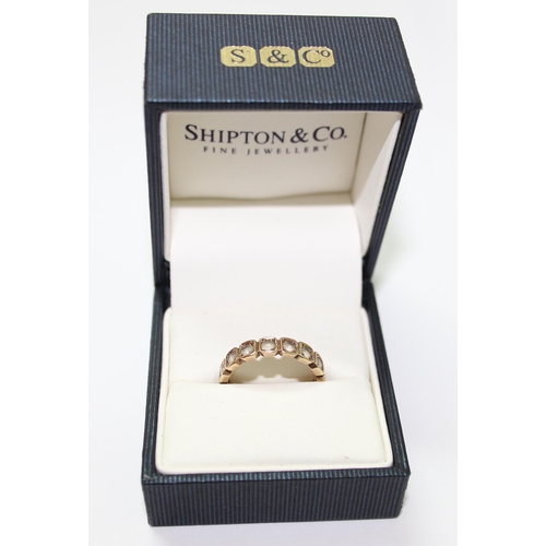 1222 - 9ct gold and white stone eternity ring, approx size M & 3g gross