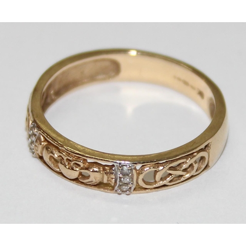 1223 - 9ct gold and white stone band with Claddagh motif, approx size R & 2.6g gross