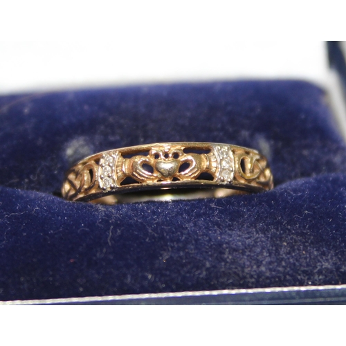 1223 - 9ct gold and white stone band with Claddagh motif, approx size R & 2.6g gross