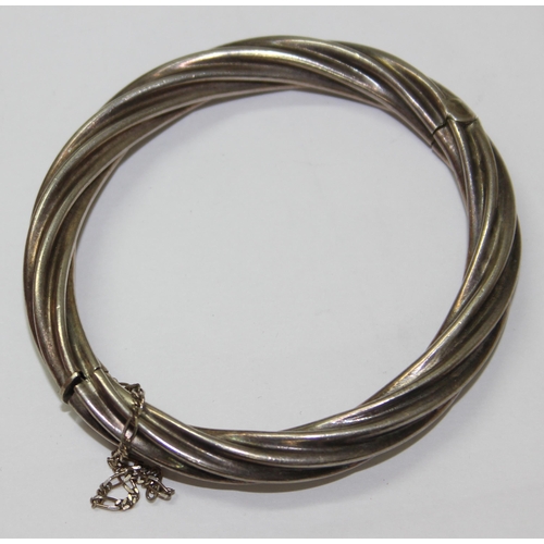 1228 - Silver bracelet in twisted wire style with safety chain, marked 925, approx 28.5g gross