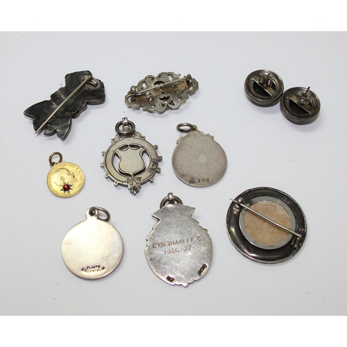 1231 - Quantity of silver and white metal brooches and watch fobs, approx 67g gross