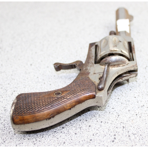 1021 - A vintage starting pistol and a revolver, both with parts missing