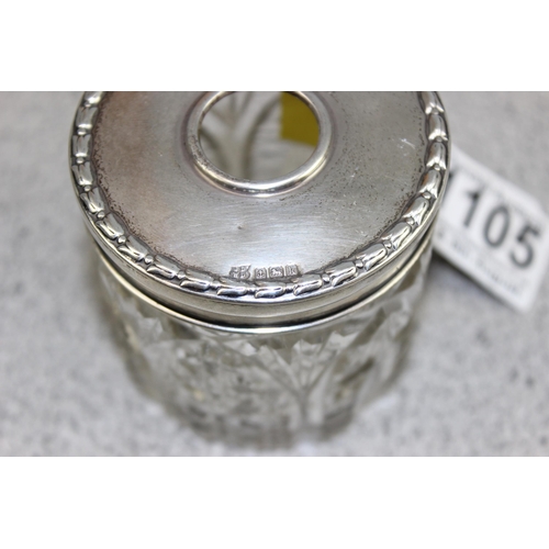 1105 - A silver topped and cut glass hair tidy pot, Birmingham 1909 by James Deakin & Sons, top weighs appr... 