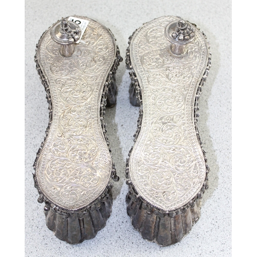 1125 - A rare pair of Indian white metal ceremonial Paduka sandals, likely 19th century. These shoes are ma... 