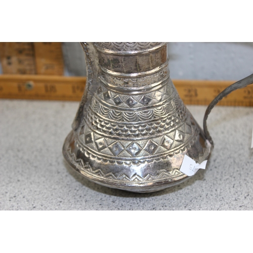 1128 - An Islamic or Ottoman Dallah coffee pot, white metal (likely silver but unmarked) decorated with var... 