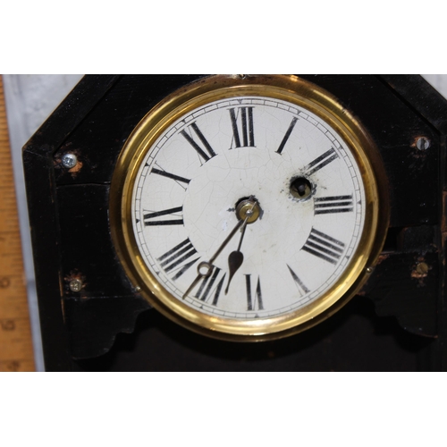 1410 - A late 19th century American wooden cased mantel clock by Philipp Haas, key and pendulum