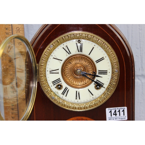 1411 - An Edwardian Lancet shaped clock with Ansonia movement, key and pendulum, the case with Sheraton sty... 