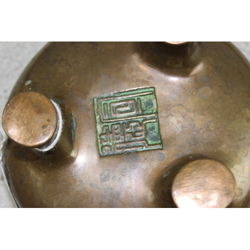 1625 - An antique Chinese bronze censor standing on 3 feet, impressed seal mark to base, approx 125mm in di... 