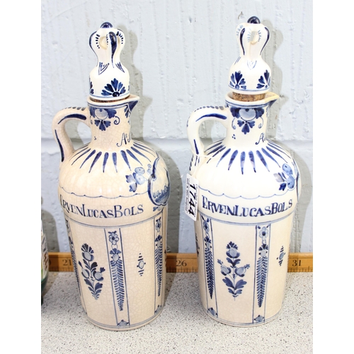 1744 - A pair of vintage Delft Bols decanters, an antique white glazed figure of Putto a/f & a pair of Etru... 