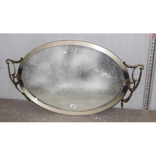 432 - A classical style mirror with decorative swags