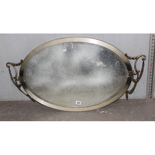 432 - A classical style mirror with decorative swags