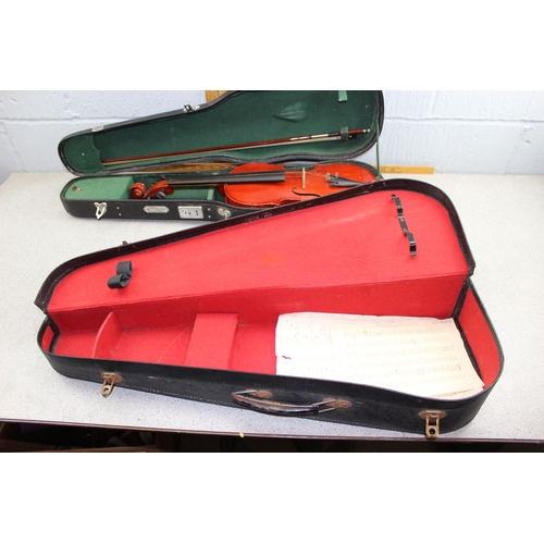 661 - Chinese made student's violin in case, with bow and a spare case