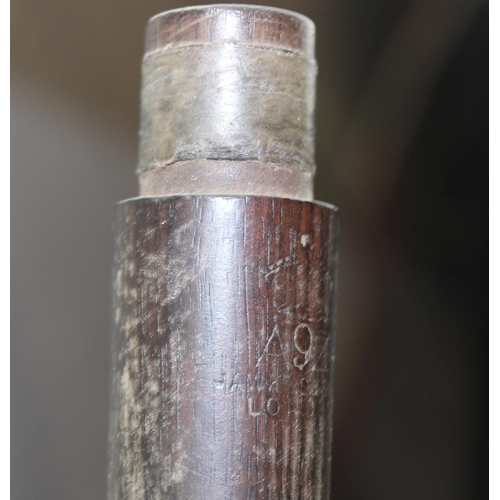 663 - An antique rosewood piccolo by Hawkes of London, possibly WW1 military issue but marks illegible