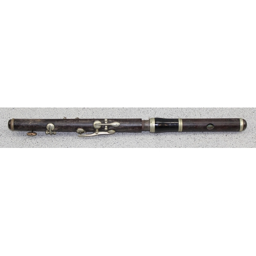 663 - An antique rosewood piccolo by Hawkes of London, possibly WW1 military issue but marks illegible