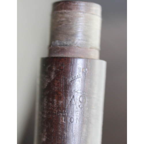 663 - An antique rosewood piccolo by Hawkes of London, possibly WW1 military issue but marks illegible