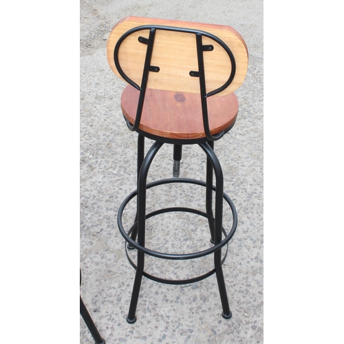 88 - A pair of industrial style machinists stools