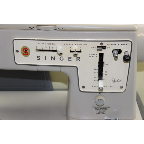 896 - Singer model 457 sewing machine in case