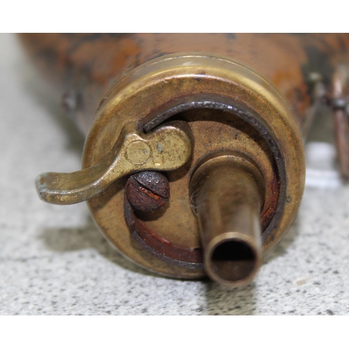 1030 - Copper and brass shot or powder flask decorated with birds and gun dog