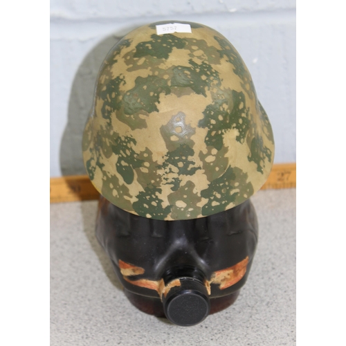 1037 - Military themed Jim Beam novelty ceramic bourbon whiskey decanter in the form of a GI helmet and com... 