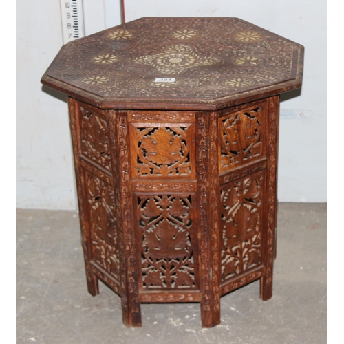 104 - A vintage Indian carved folding hardwood tea table