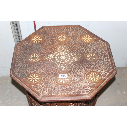 104 - A vintage Indian carved folding hardwood tea table