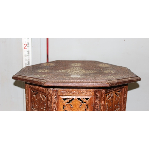 104 - A vintage Indian carved folding hardwood tea table